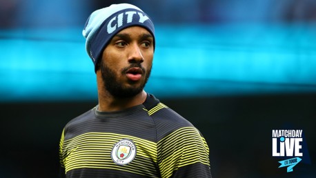 A Manchester City player in training kit with the club logo visible on the chest, wearing a beanie, and the Matchday Live logo is visible in the corner.