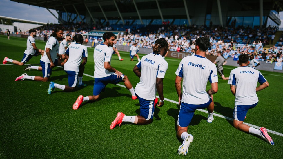 LIMBERING UP : The team partake in some important stretches.