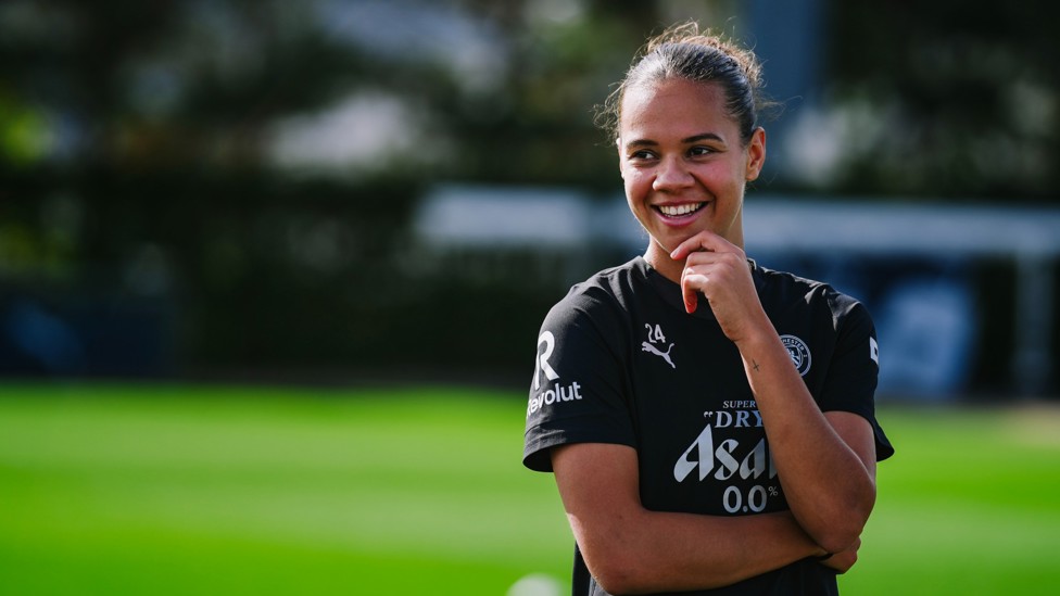 QUICK BREAK : Iman Beney enjoying a joke with her team-mates during a water break. 