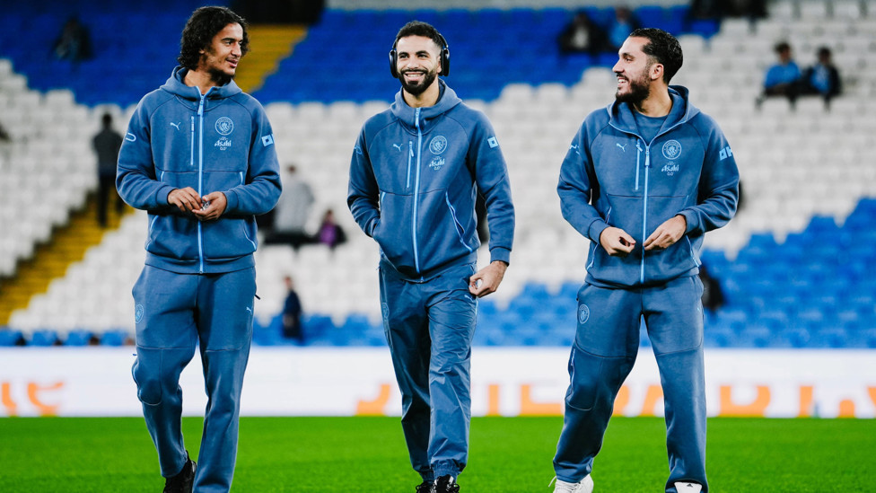 THREE AMIGOS : Bouaddi, Aït-Nouri and Cherki share a joke as they check out the pitch.