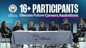 A group of 16+ participants from Manchester City are seated at a table discussing future career aspirations as part of the City in the Community initiative.