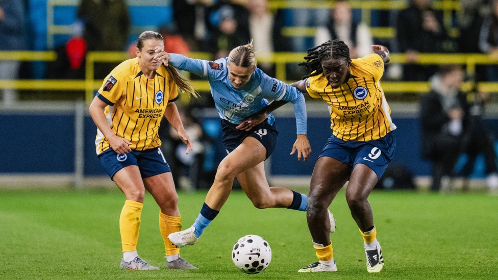 BATTLING : Kerstin Casparij tussles with Fran Kirby and Michelle Agyemang