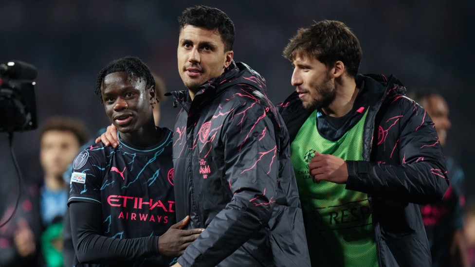 ALL SMILES: Rodrigo and Ruben Dias salute Mo after his impressive debut.