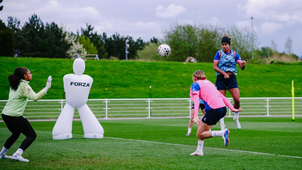 GET UP  : Mary Fowler rises highest to meet the cross. 