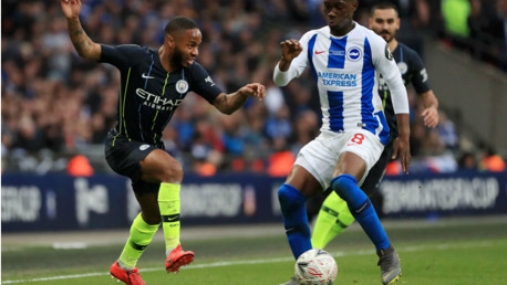 UP AND AT 'EM: Raheem Sterling takes on Brighton's Yves Bissouma