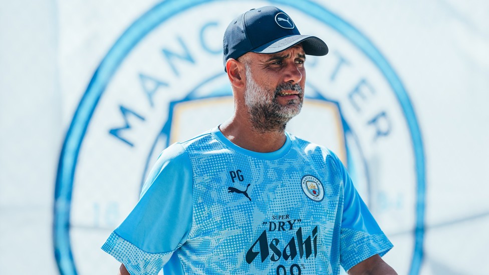 HEADING OUT: Pep on his way to the training pitches