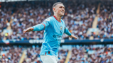 PHIL YOUR BOOTS: Foden celebrates after making it 6-1, completing his hat-trick!