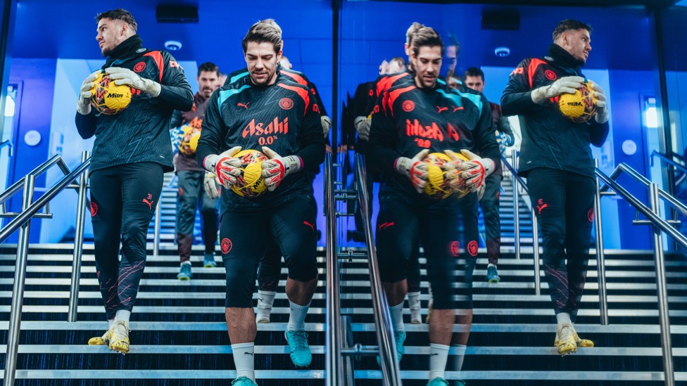 SEEING DOUBLE : The goalkeeper group make their way out for the pre-match warm up.