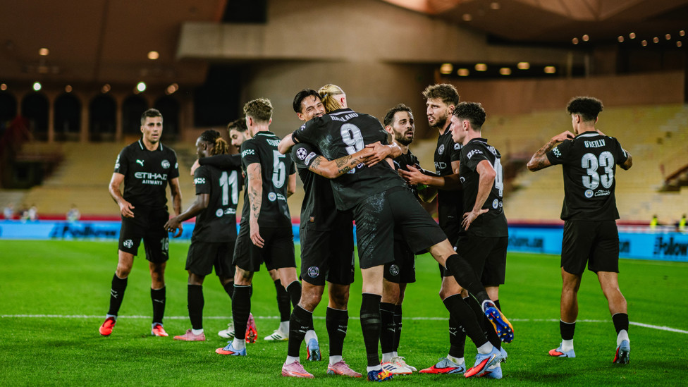 HAALAND HUG : Haaland celebrates with his teammates.