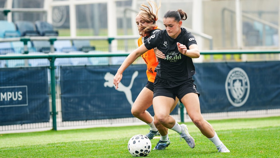 FRENIMES : Lily Murphy and Codie Thomas battle for the ball. 