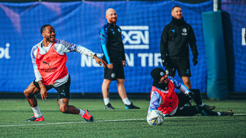 SMILES BETTER : Raheem Sterling and Ilkay Gundogan see the funny side of things as our German ace takes a tumble