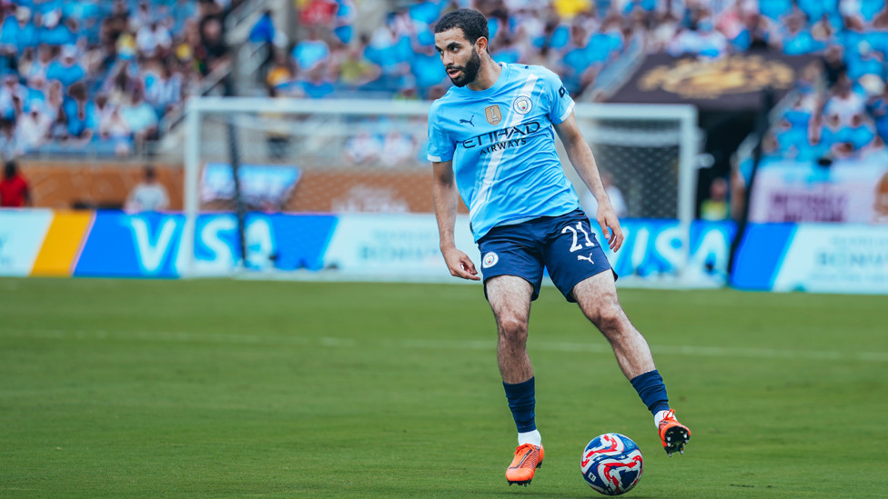 AMAZING AIT-NOURI : On the ball shortly after his superb assist for Doku's opener.