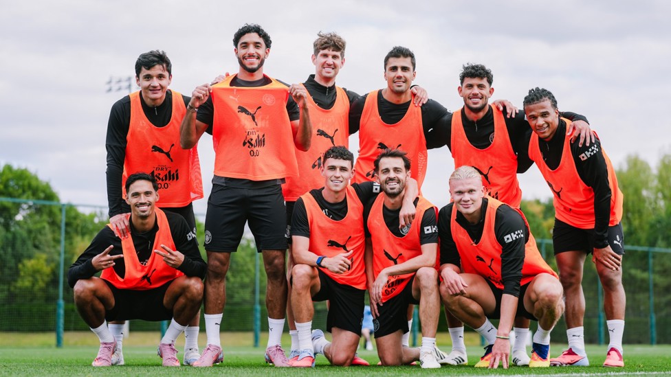 TEAM: posing for a picture 