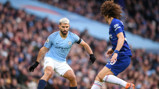 Sergio Aguero takes on David Luiz.
