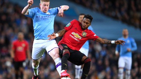 TUSSLE: De Bruyne challenges Fred for the ball in midfield.