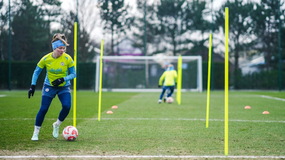 WING WIZARD  : Lauren Hemp uses her skills to manouever through the posts. 