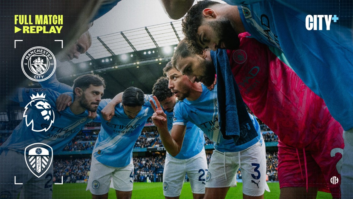 Blurred image of Manchester City team huddling captured for City+ full match replay against Leeds United in a Premier League match at Etihad Stadium.