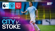 Manchester City leads Stoke City 2-0 in a live Premier League match on CITY+ platform, featuring a Manchester City player in action.