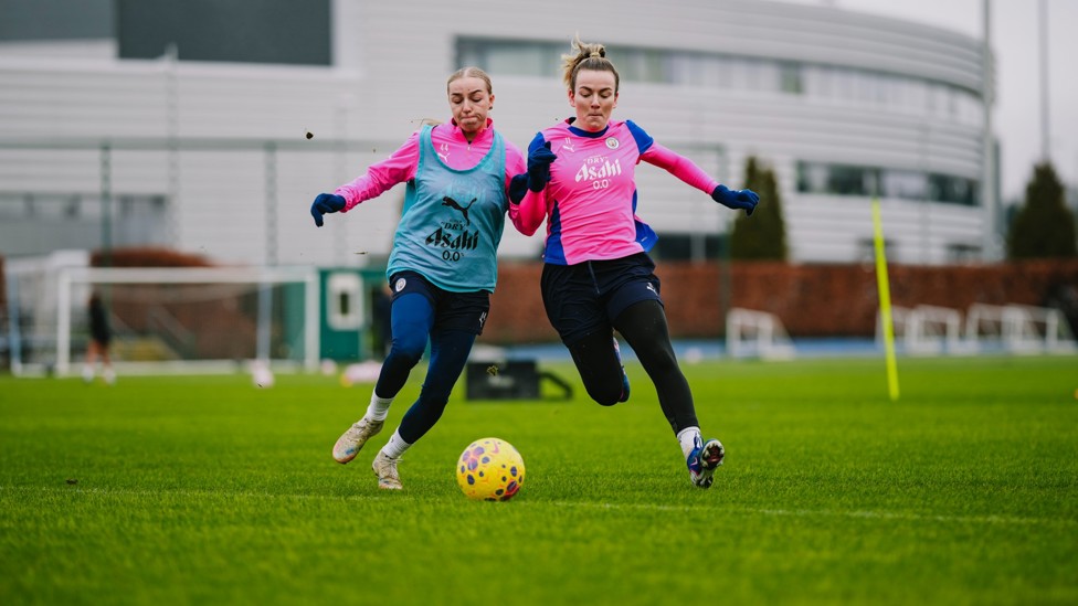 Hard shoulder : Codie Thomas and Lauren Hemp fight for the ball