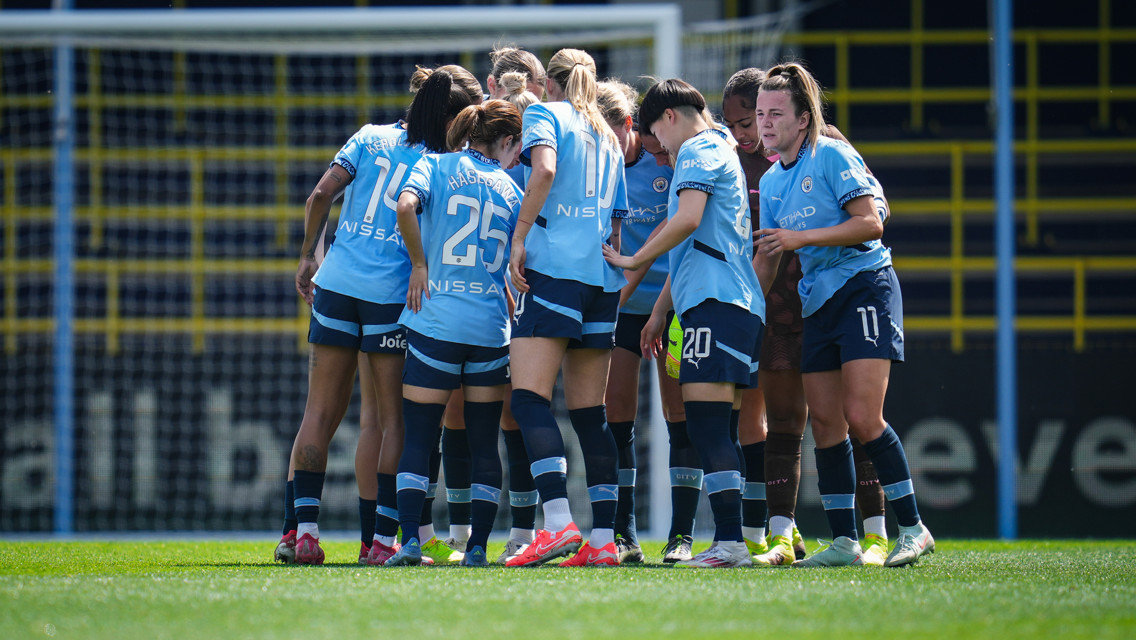 Man City players in a huddle