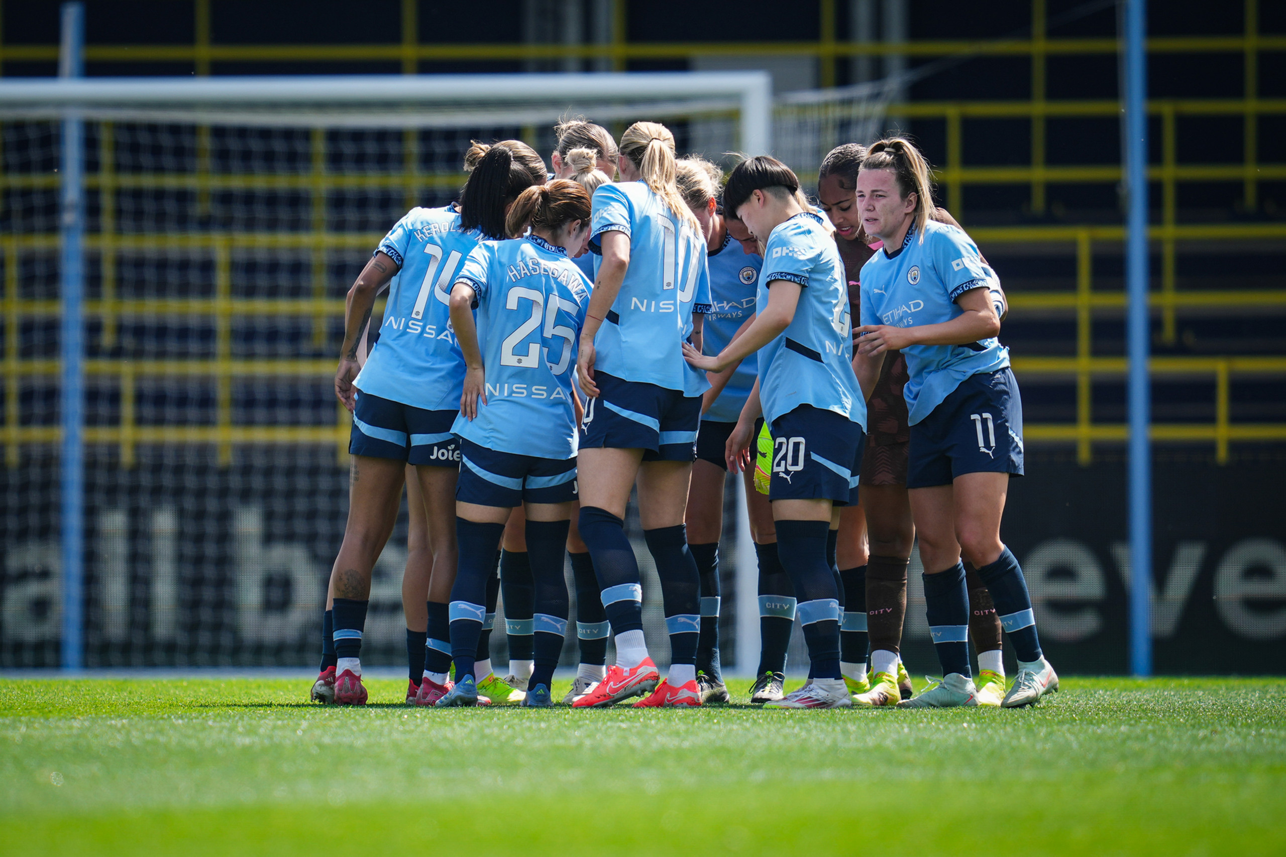 Man City players in a huddle