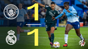 Scoreboard showing a 1-1 draw between Manchester City and Real Madrid, with players from both teams competing for the ball during the match.