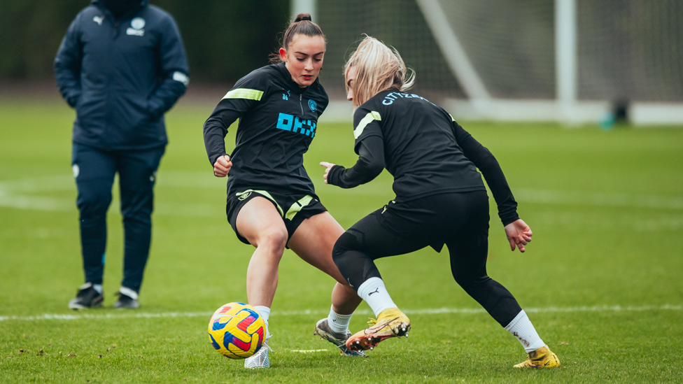 TOUCH TIGHT : Annie Hutchings and Lauren Hemp battle for possession