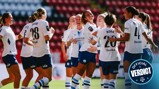 A group of female football players celebrating a goal on the field, wearing white and blue Manchester City kits. There is a badge with 'Official Verdict' in the corner.