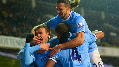 Edin Dzeko celebrates scoring against Spurs.