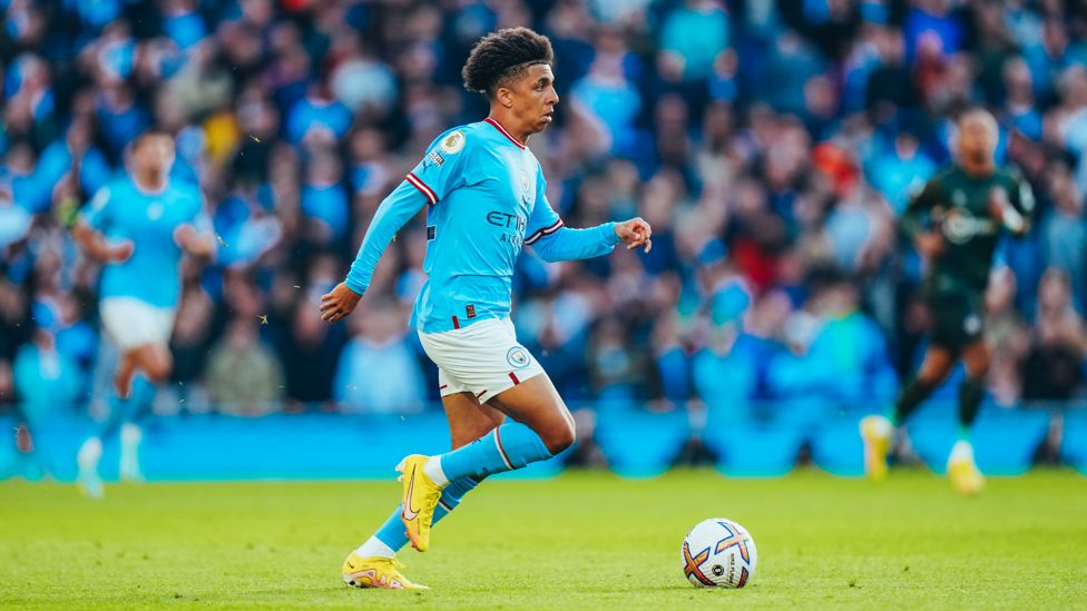 BREAKING FREE : Lewis looks to start another attack as he moves into midfield from his defensive position.