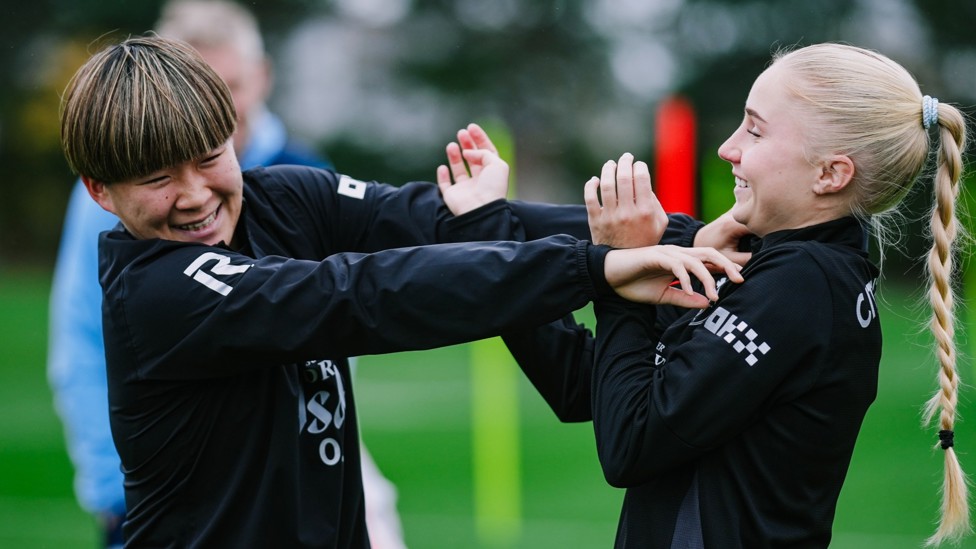 FRIENDLY TUSSLE: Aoba Fujino and Laura Blindkilde Brown share a light hearted moment