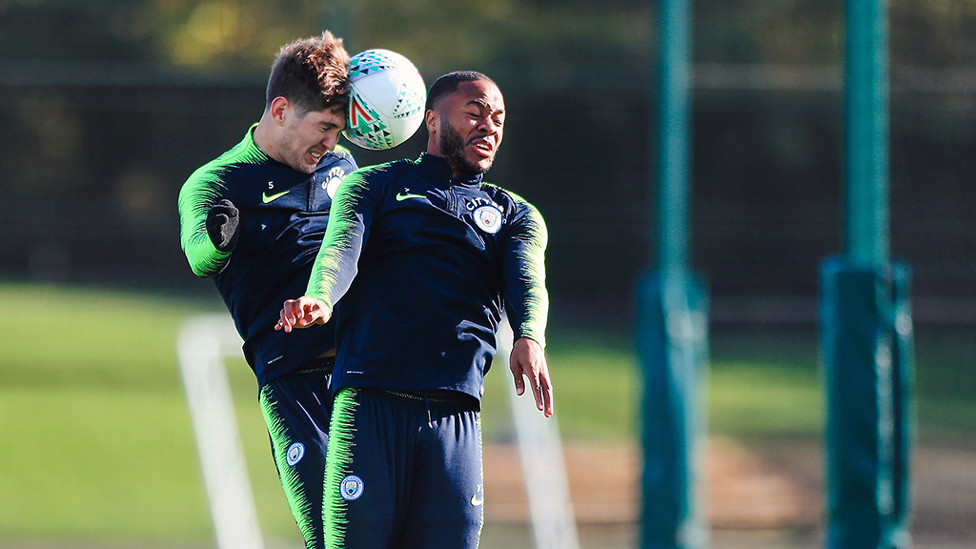 HEAD BOYS : John Stones rises with Raheem Sterling to contest this aerial challenge