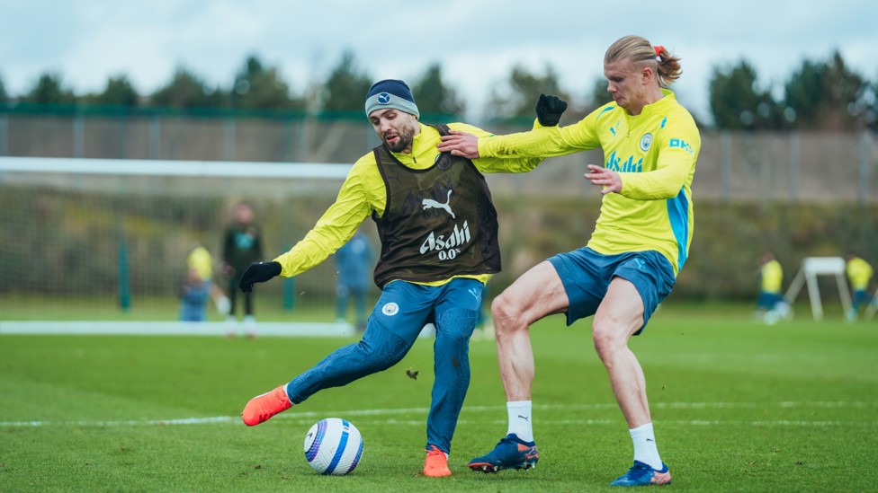 BATTLE : Erling Haaland tries to deny Mateo Kovacic's shot.