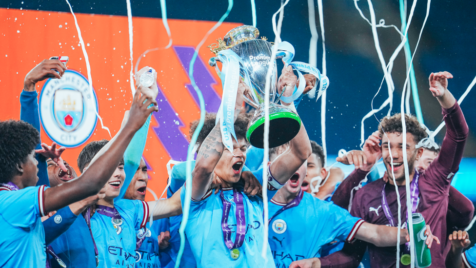 STREAMERS EVERYWHERE : Confetti and streamers are fired across the ceremony stage as the City players celebrate.