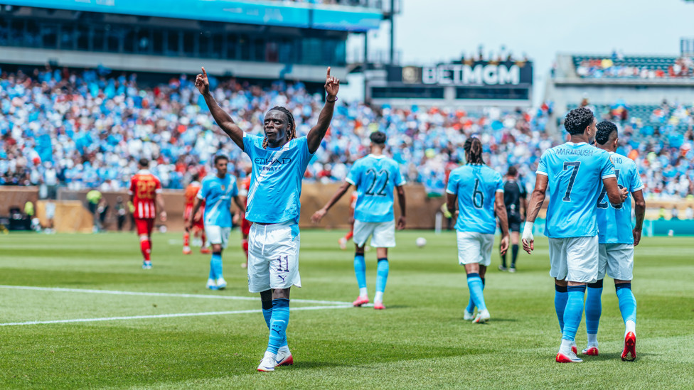 JOLLY JEREMY : Celebrates his goal.