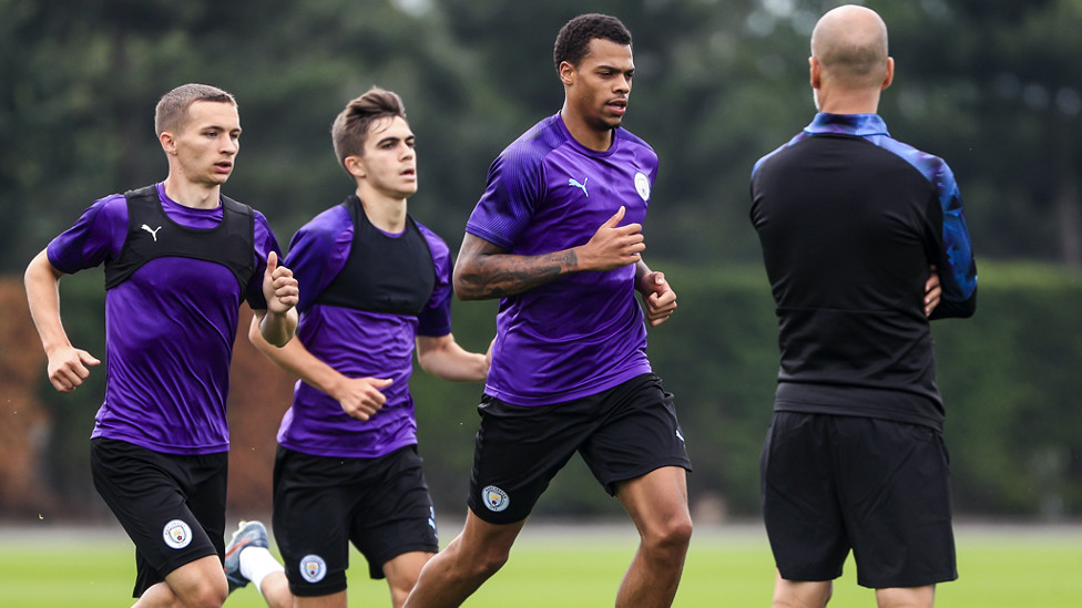 ON THE RUN : Lukas Nmecha is put through his paces as the boss oversees Tuesday's session