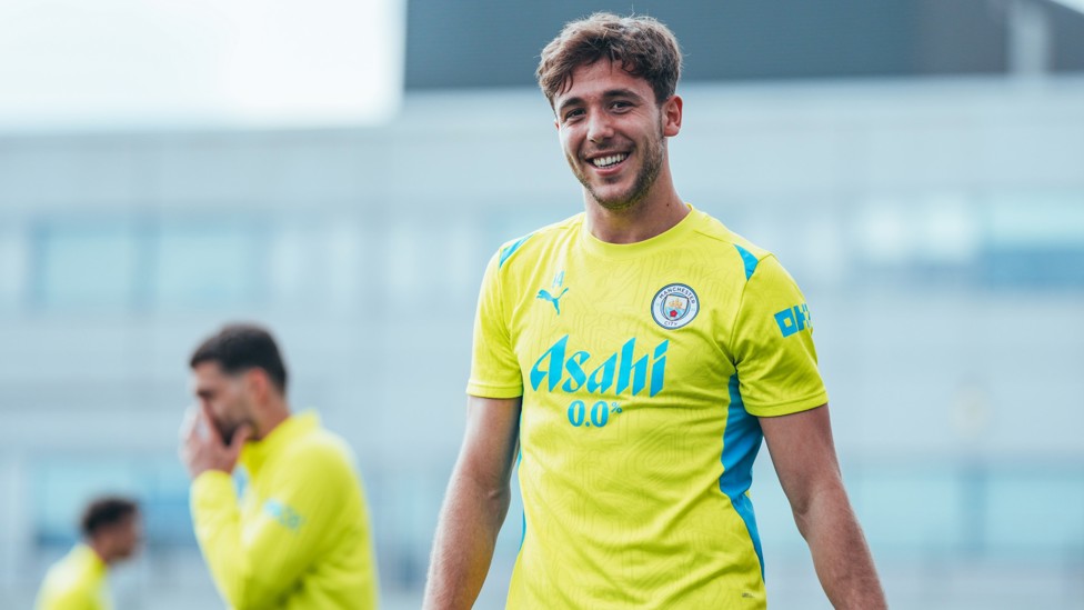 ALL SMILES  : Nico in high spirits during Monday's training. 