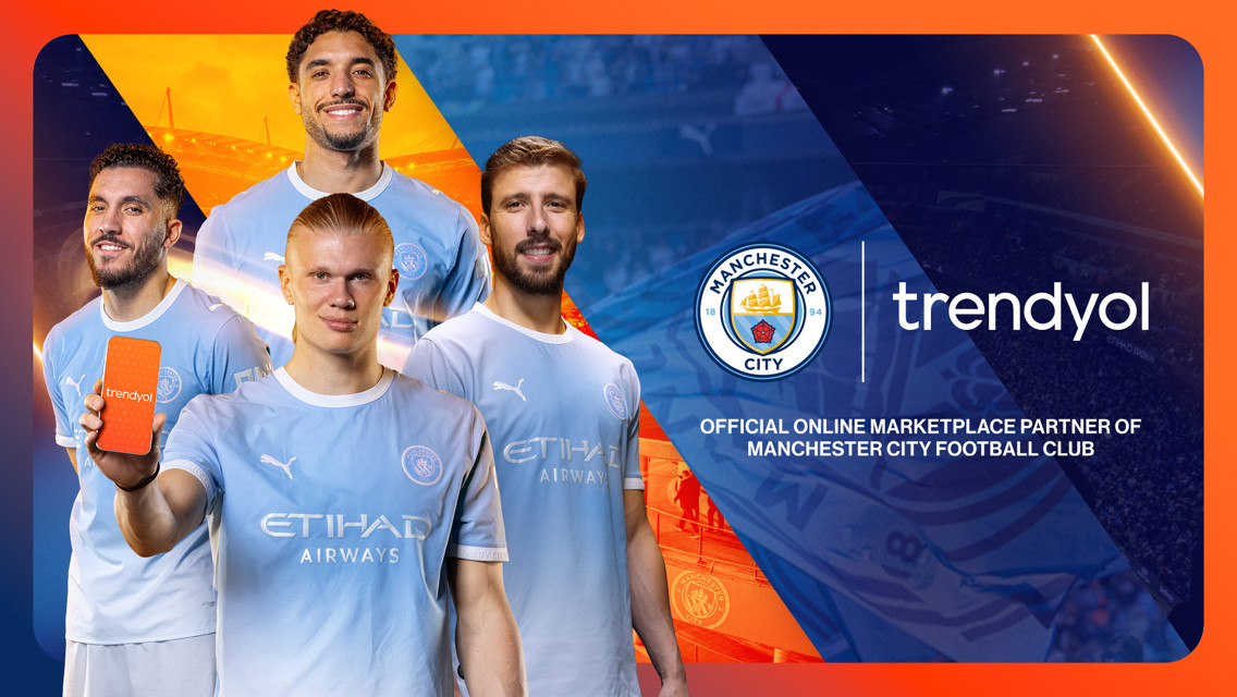 Manchester City players in blue jerseys promoting Trendyol, official online marketplace partner. Includes club logo and Etihad Stadium background.