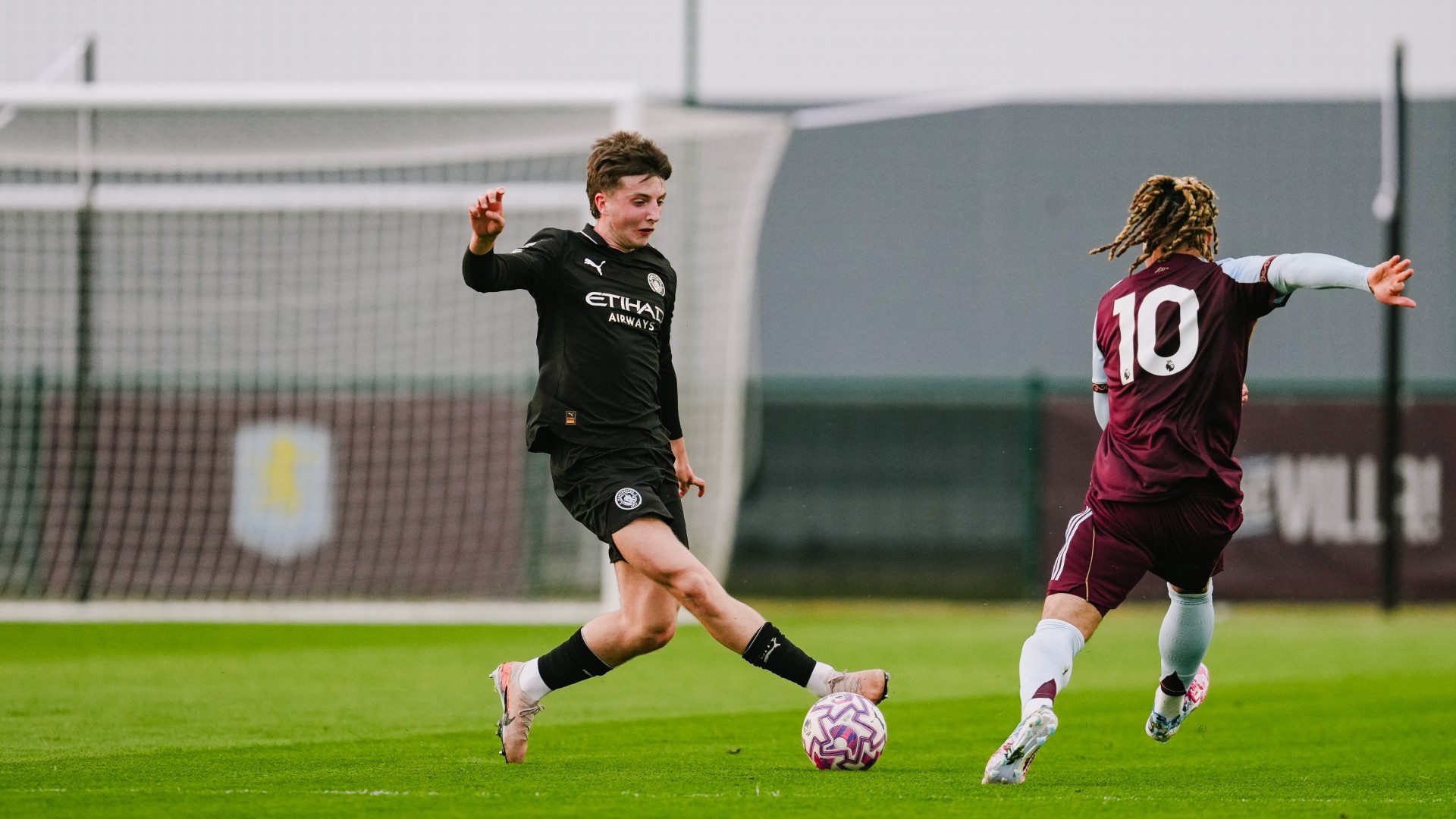 ON THE BALL : Charlie Gray skips away from Luka Lynch