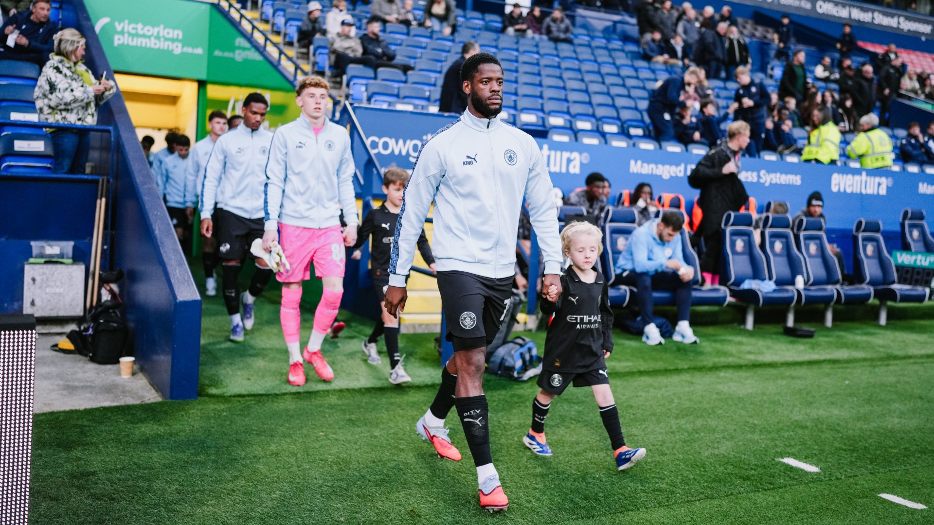 WALKOUT: Luke Mbete leads out the City youngsters.