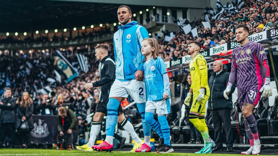 GAME TIME : Walker leads the team out.