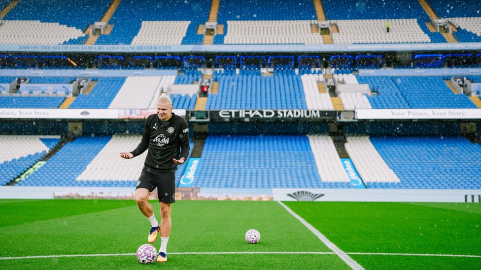 DOWNPOUR : Erling Haaland braves the elements