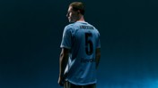 A football player with 'ANDERSON' and number '5' on the back of his jersey stands against a dark background.