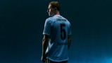 A football player with 'ANDERSON' and number '5' on the back of his jersey stands against a dark background.