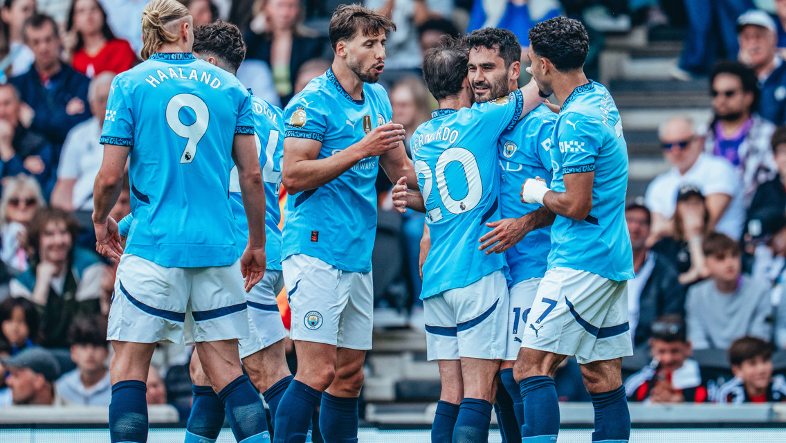 GROUP HUG: Gundogan feels the love!