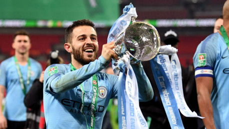 SILVA DREAM MACHINE: Bernardo lifts the Carabao Cup aloft again after our dramatic penalty shoot-out win over Chelsea last month