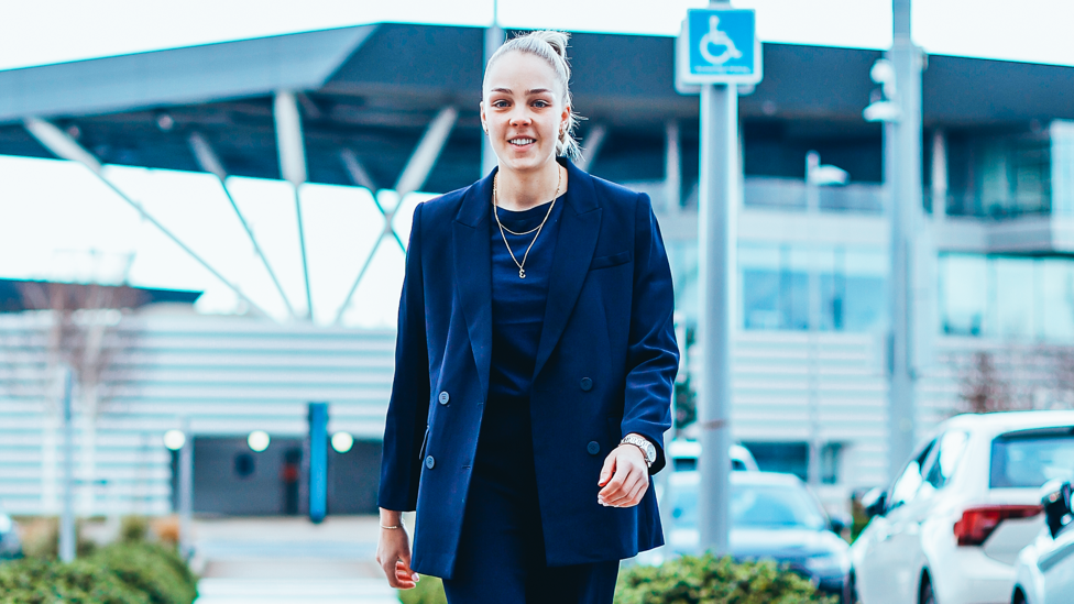 ELLIE READY : Ellie Roebuck makes her way towards the Etihad Stadium for the derby.