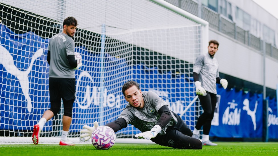 STEADY EDDIE : Ederson keeps his eyes on the ball as he shows his stopping skills