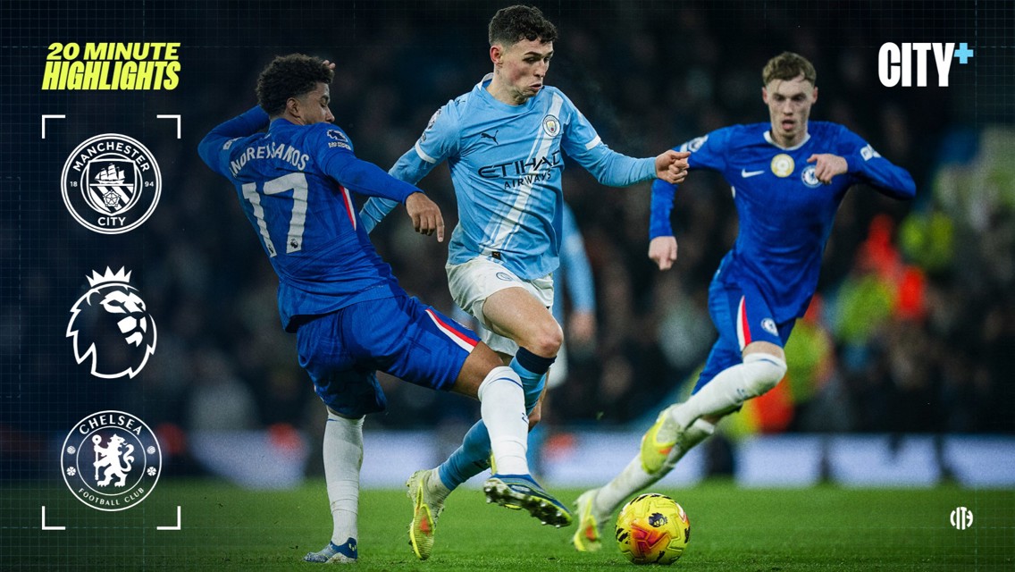 Manchester City player in light blue kit competes with Chelsea players in dark blue kits during a Premier League match. Manchester City and Chelsea logos, Premier League logo, and 'City+' text are visible.