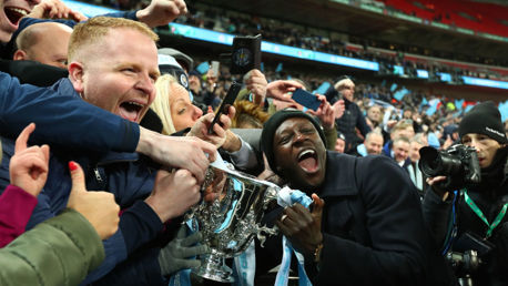 TOGETHER: Benjamin Mendy celebrates with fans after the 2019 Carabao Cup final,